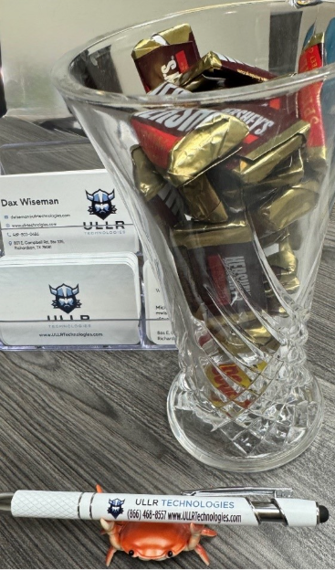 Mini chocolate bars in a glass dish.