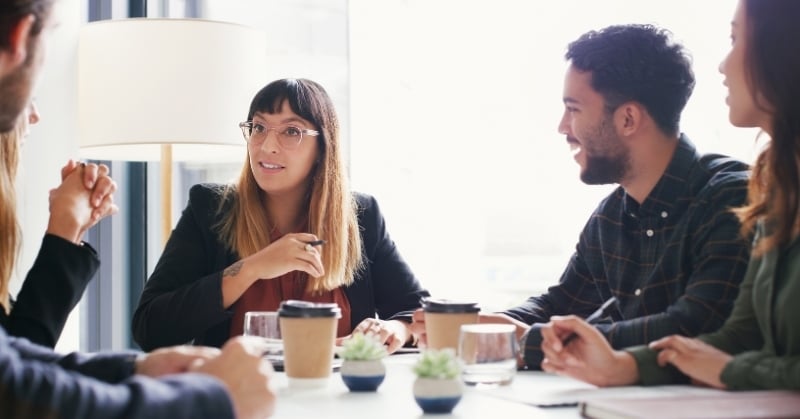 Accounting professionals collaborating during a team meeting to discuss strategies, roles, and workflows in an evolving AI-driven workplace.
