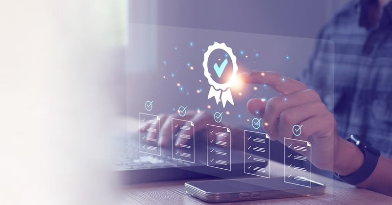 Person interacting with a digital certification icon and checklist interface, representing artificial intelligence (AI) assurance, compliance, and verification standards.