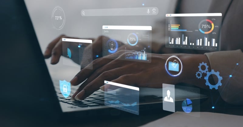 A person working on a laptop with floating digital dashboards representing data analytics, cybersecurity, email, performance metrics, and cloud-based tools, illustrating the integration of technology and automation in modern accounting practices.