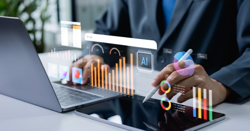 AI-powered accounting dashboard with financial charts and business data on a laptop and tablet.