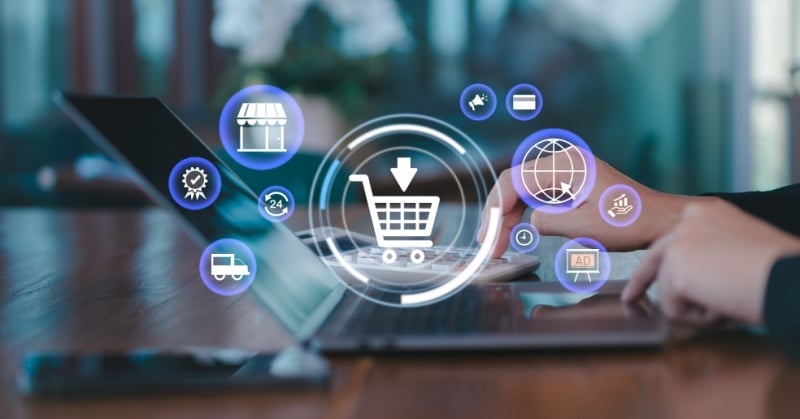 Digital shopping cart icon and e-commerce symbols overlay a person using a laptop, representing online retail and Amazon accounting workflows.