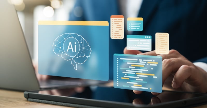 A business professional uses a tablet and laptop while interacting with floating digital graphics, including an "AI" brain icon, code blocks, and data elements, symbolizing artificial intelligence and data processing.
