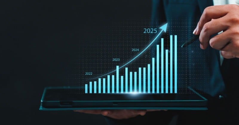 3D graph coming out of a tablet held by a businessman